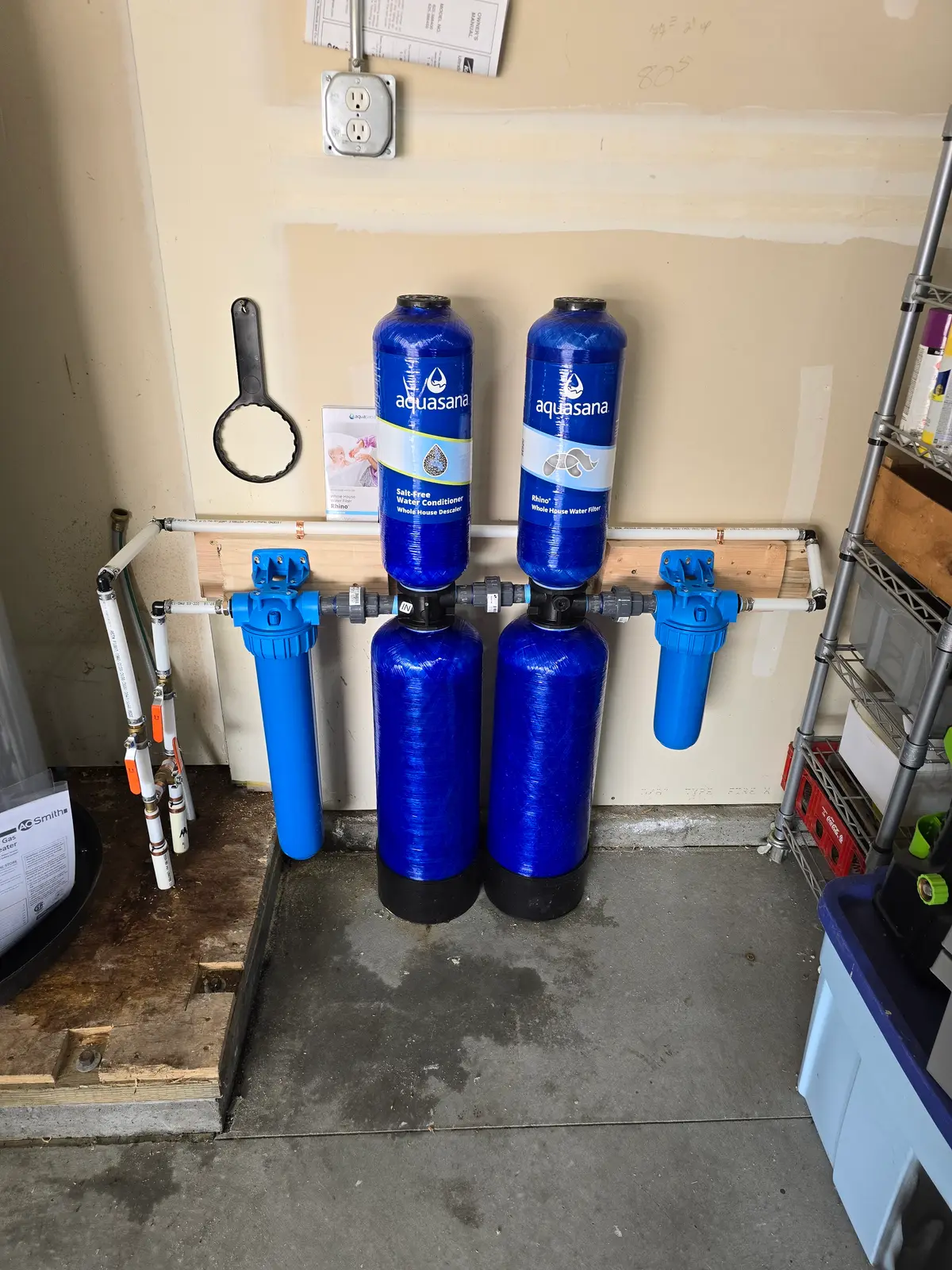Whole-house water filtration system installed by Revolution Plumbing in a Treasure Valley garage